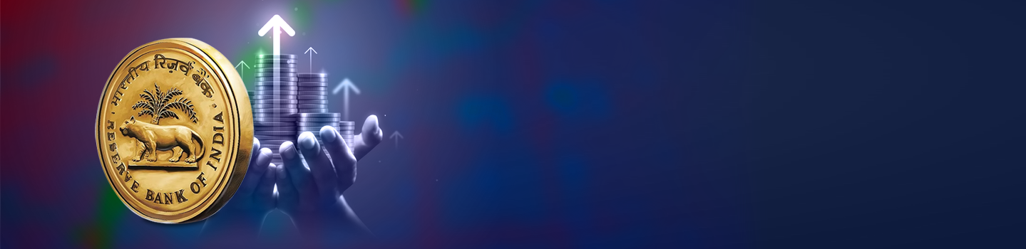 The gold Reserve Bank of India emblem beside hands holding rising coin stacks with upward arrows on a dark blue banner