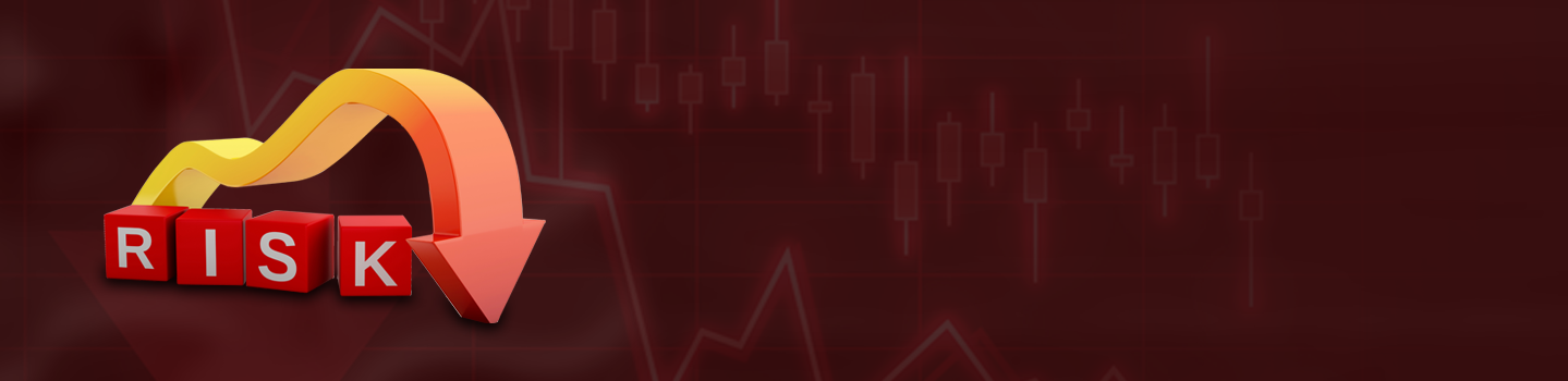 Red 3D blocks spelling RISK with a downward arrow over a falling stock chart